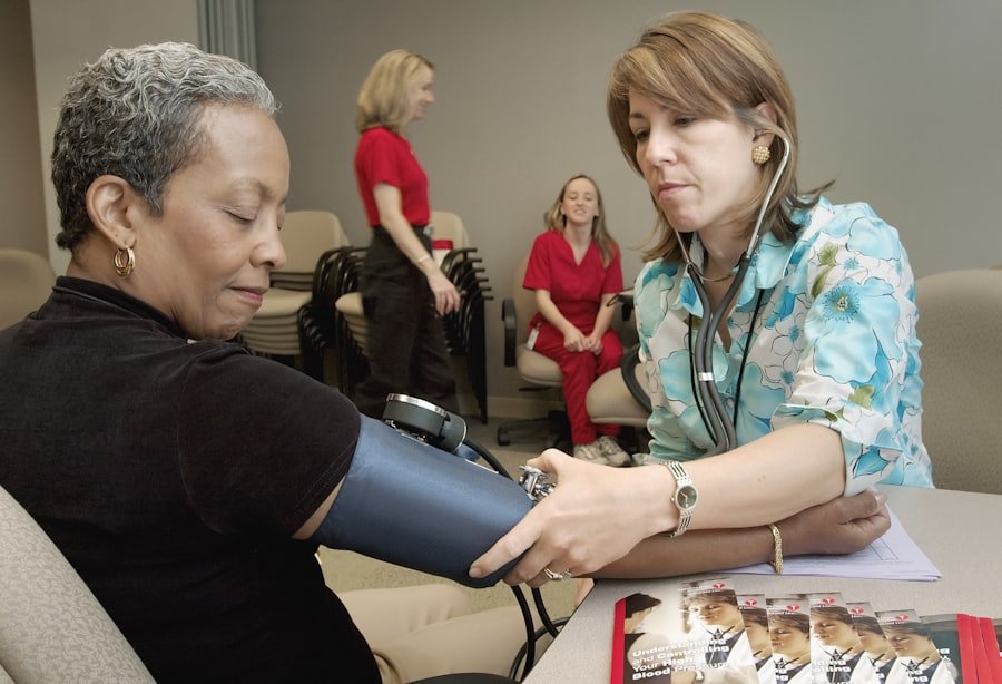 Healthcare worker using a sphygmomanometer to check blood pressure