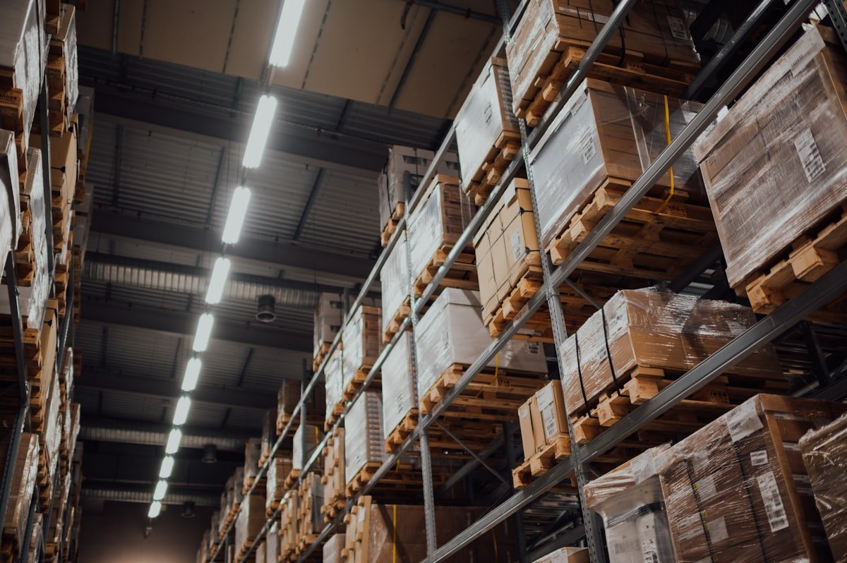 Organized warehouse shelving stocked with supply boxes